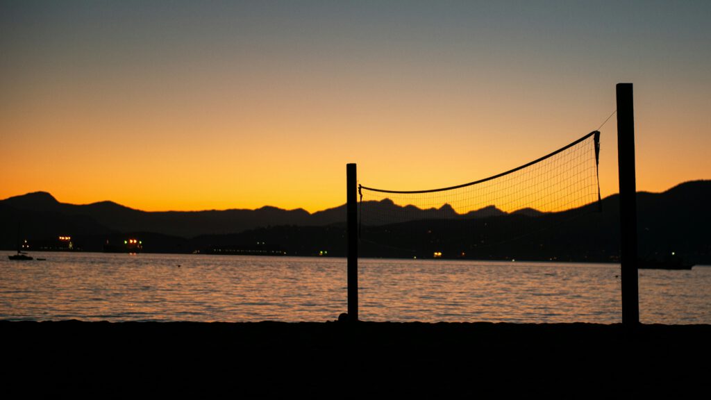 A volleyball net at kits beach at sunset